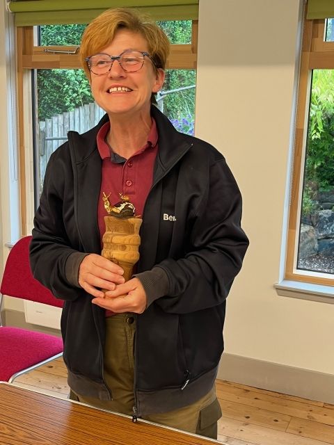 Snail race winner Julie Hanley-Davies with trophy and her snail